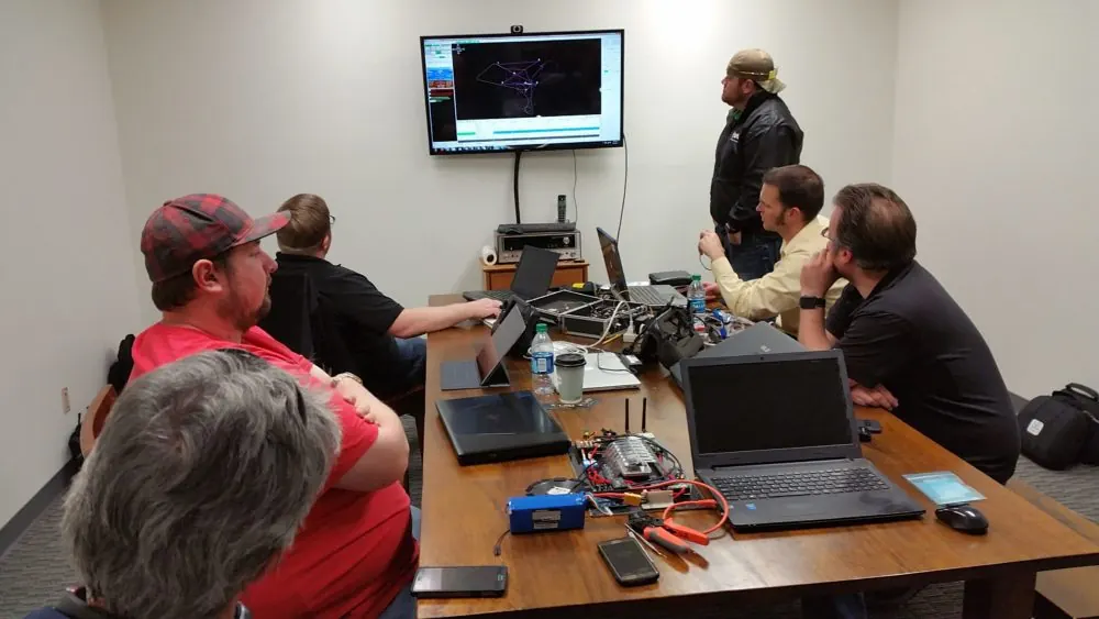 Delta Zee colleagues collaborating on engineering plans