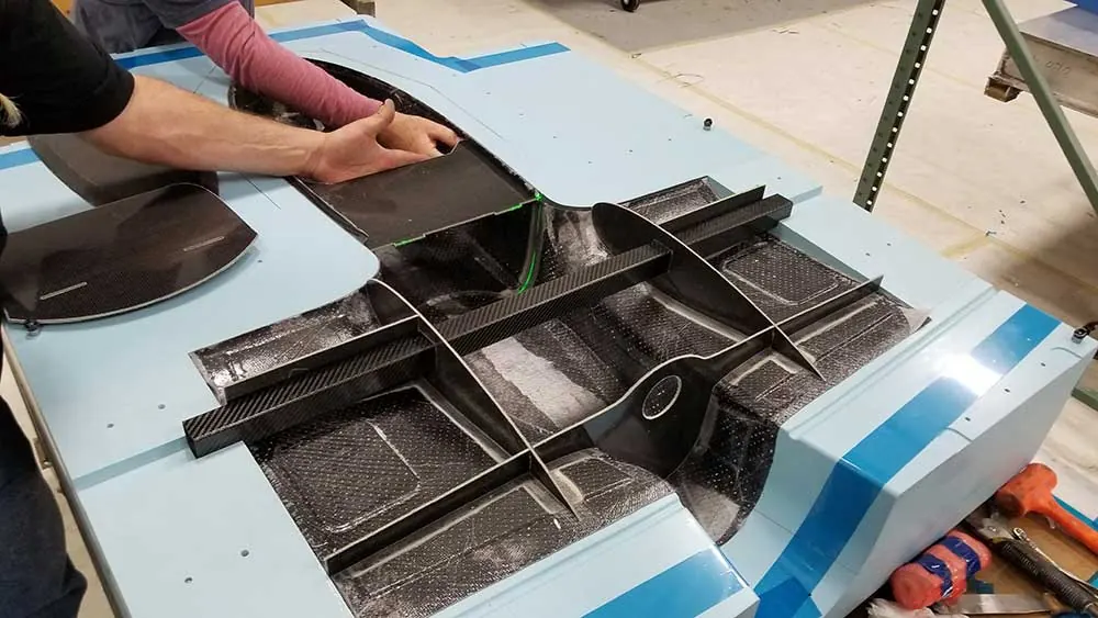 Hands working with composite material